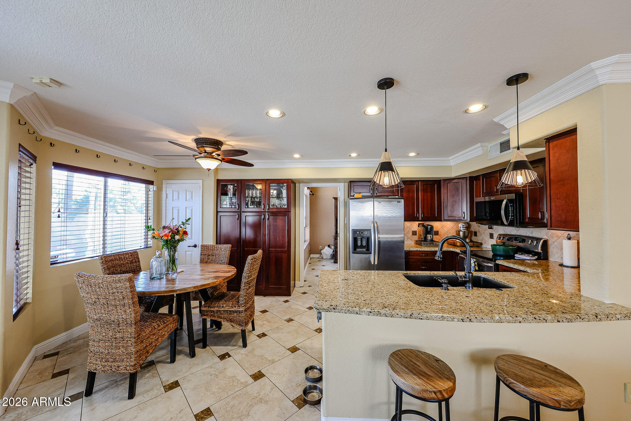 16429 South 33rd Street Phoenix, AZ 85048 - Photo 11 of 29 BREAKFAST BAR IN OPEN KITCHEN