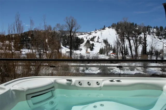 a view of a chairs and table in patio