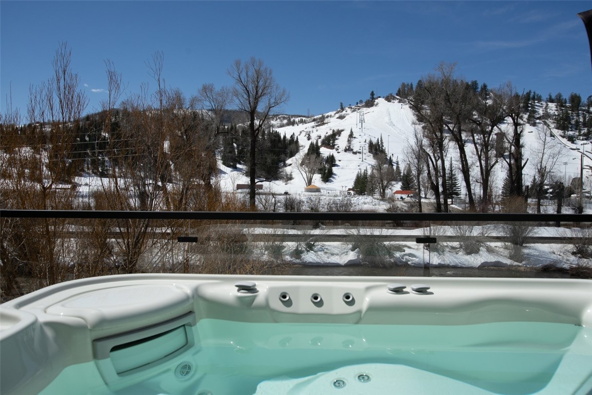 655 Yampa Street, Unit R1 Steamboat Springs, CO 80487 - Photo 13 of 49 a view of outdoor sitting area with chairs