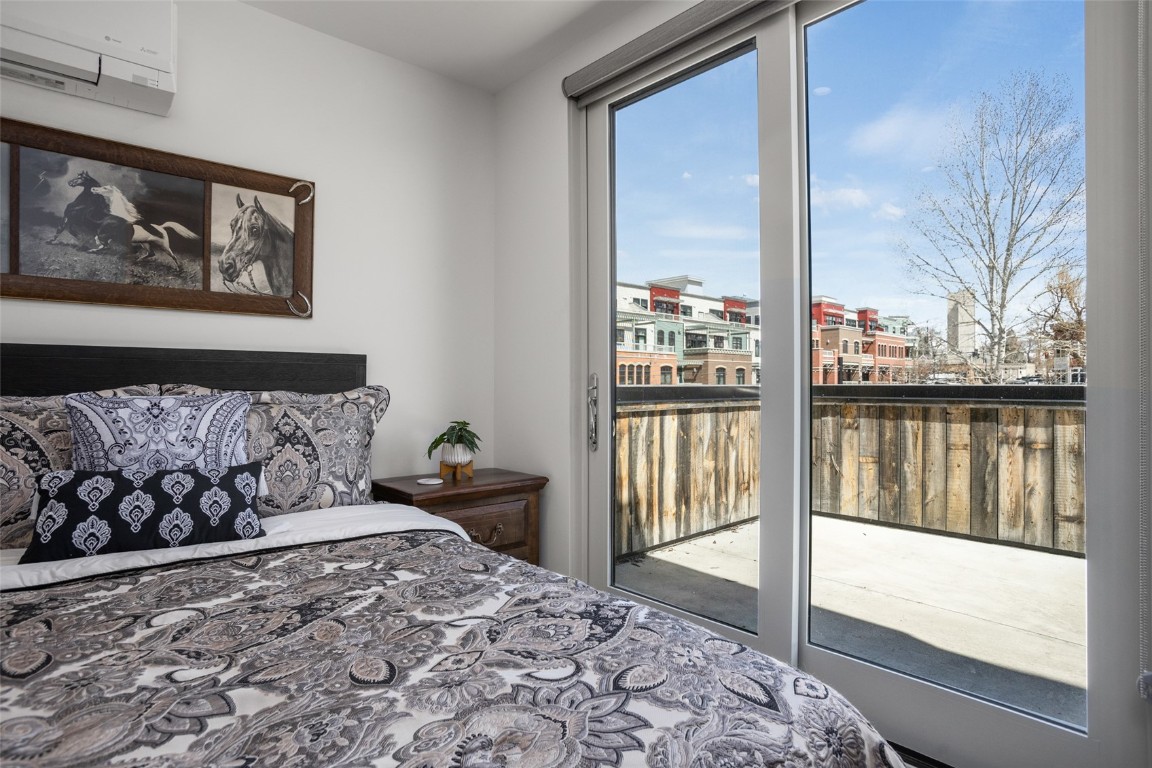655 Yampa Street, Unit R1 Steamboat Springs, CO 80487 - Photo 18 of 49 a bedroom with a large bed and a window