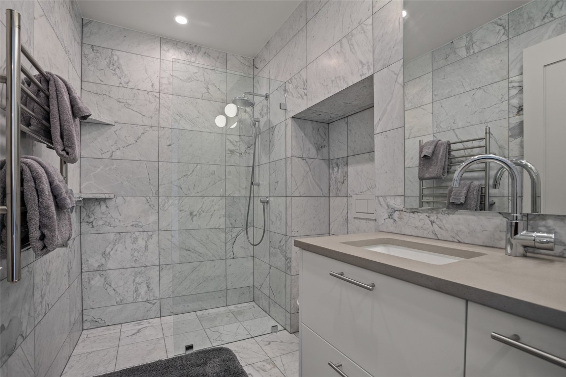655 Yampa Street, Unit R1 Steamboat Springs, CO 80487 - Photo 21 of 49 a bathroom with a sink shower and a mirror