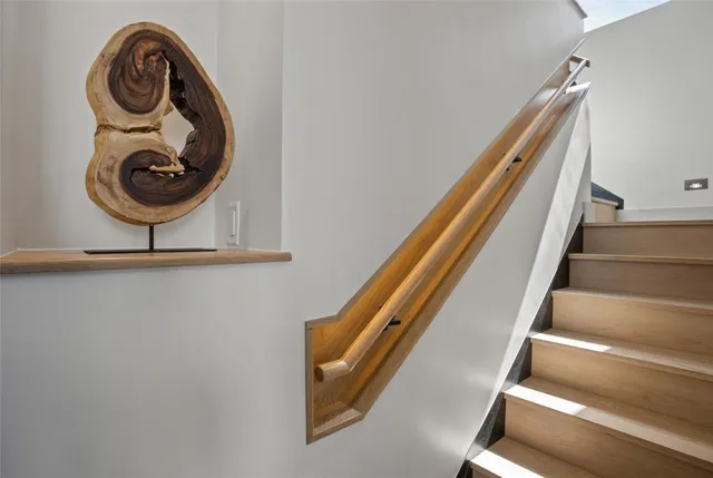 a bedroom with a large bed and a large window