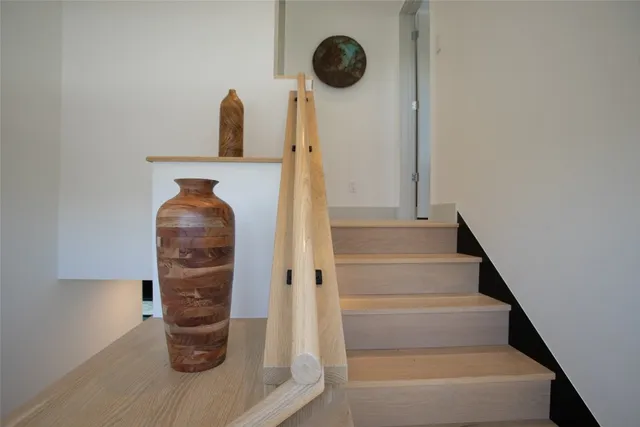 a living room with a flat screen tv a stove and a refrigerator