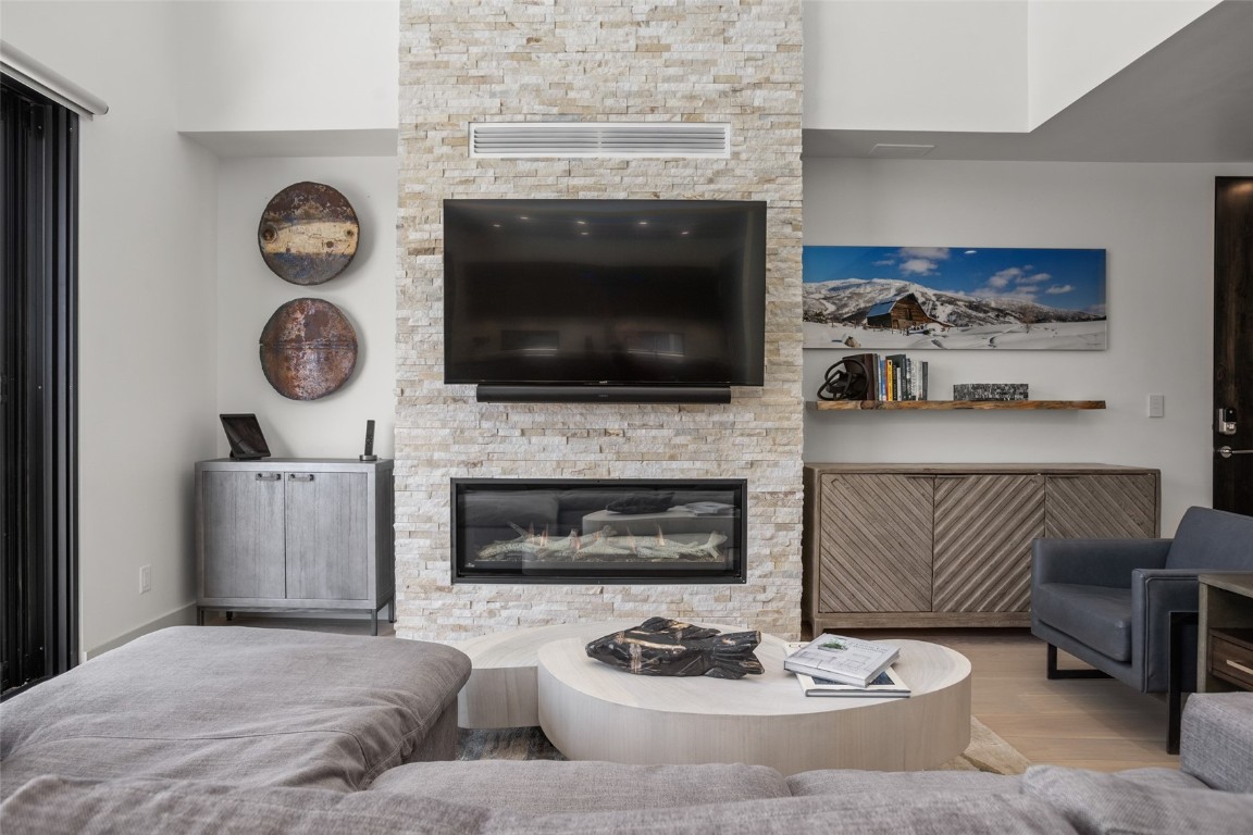 655 Yampa Street, Unit R1 Steamboat Springs, CO 80487 - Photo 3 of 49 a living room with furniture and a fireplace