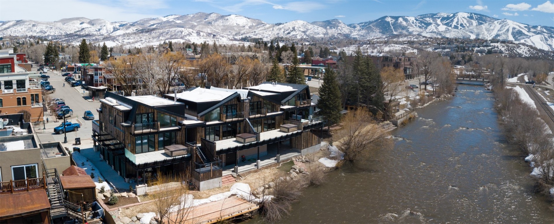 655 Yampa Street, Unit R1 Steamboat Springs, CO 80487 - Photo 47 of 49 a view of a balcony with chairs and a potted plant