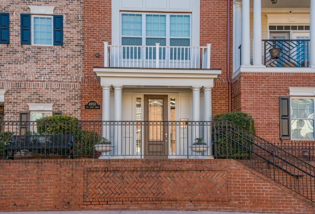 4950 Ivy Ridge Drive Southeast, Unit 203 Atlanta, GA 30339 - Photo 1 of 1 a front view of a house with a yard