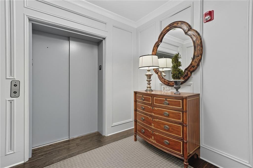 4950 Ivy Ridge Drive Southeast, Unit 203 Atlanta, GA 30339 - Photo 29 of 39 a view of room with door and wooden floor