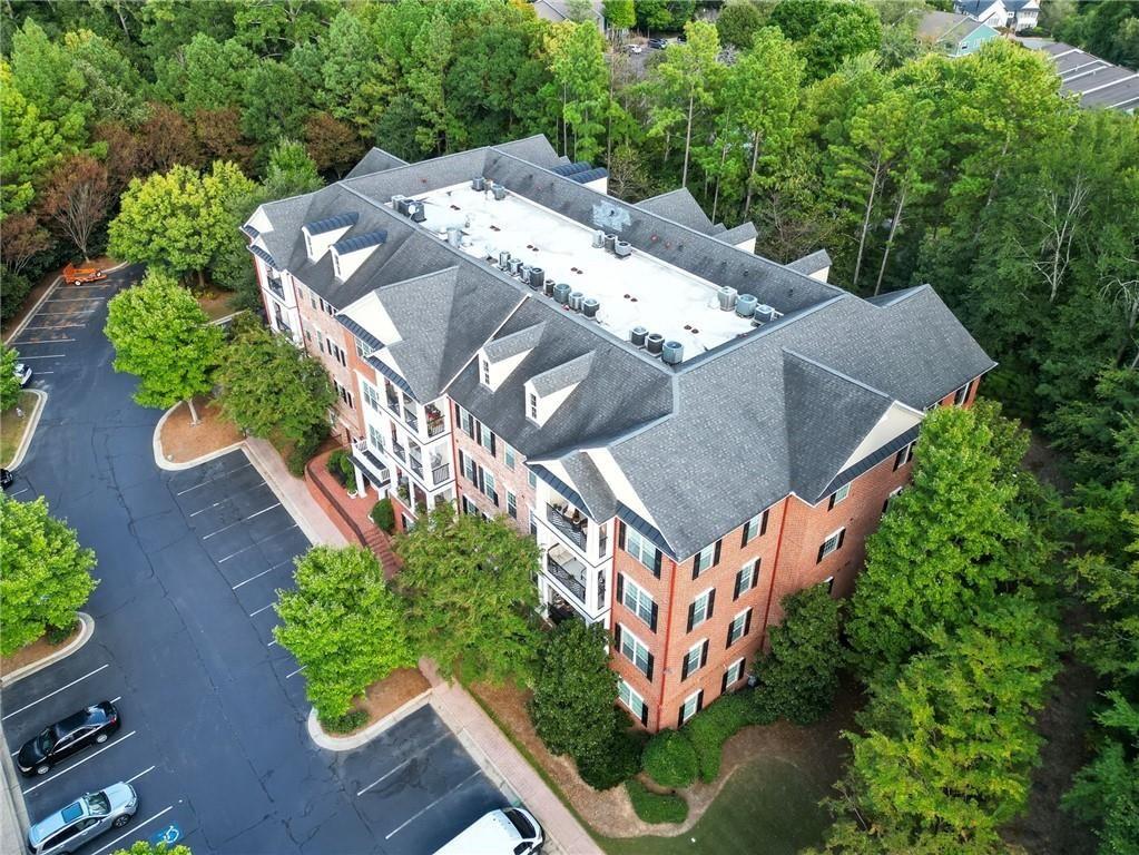 4950 Ivy Ridge Drive Southeast, Unit 203 Atlanta, GA 30339 - Photo 39 of 39 an aerial view of a house with a yard and outdoor seating