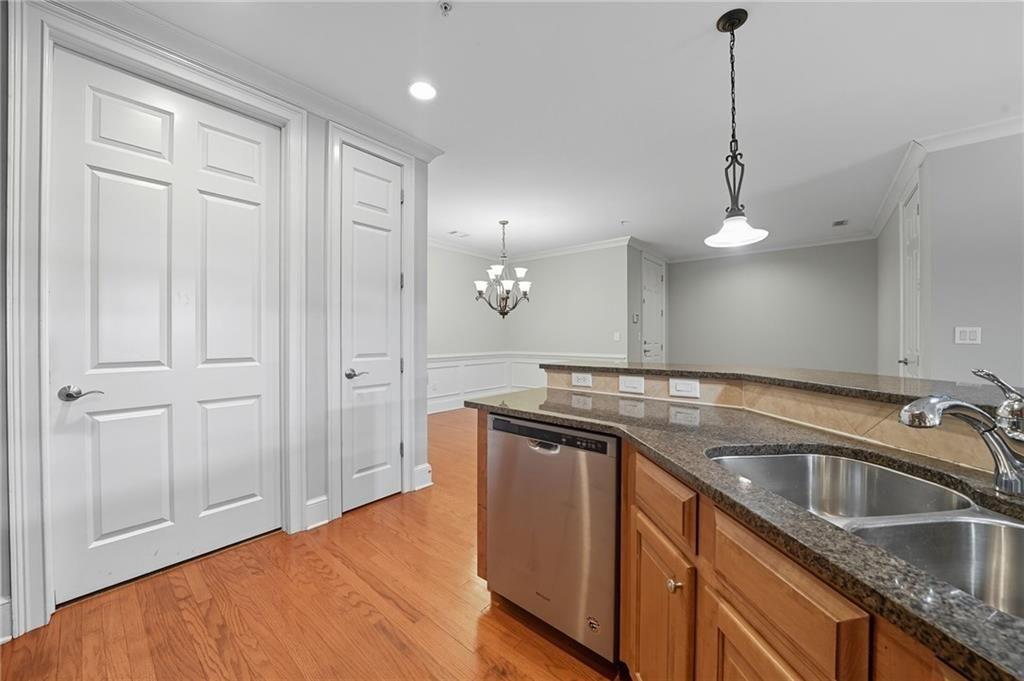 4950 Ivy Ridge Drive Southeast, Unit 203 Atlanta, GA 30339 - Photo 8 of 39 a kitchen with a sink and a refrigerator