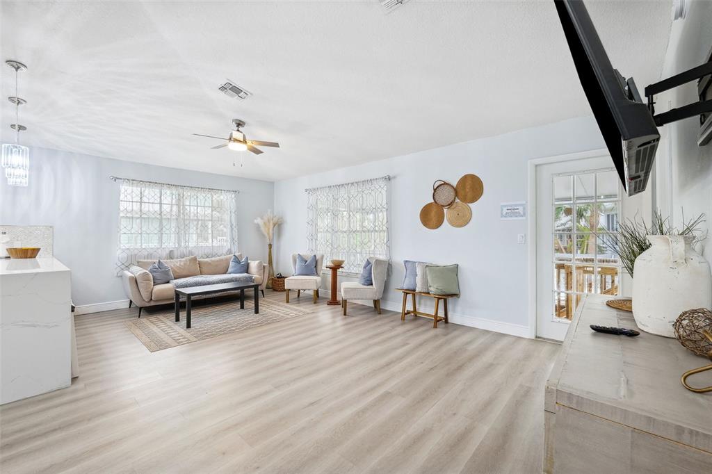 311 Poinsettia Road Anna Maria, FL 34216 - Photo 8 of 36 a living room with furniture and a window