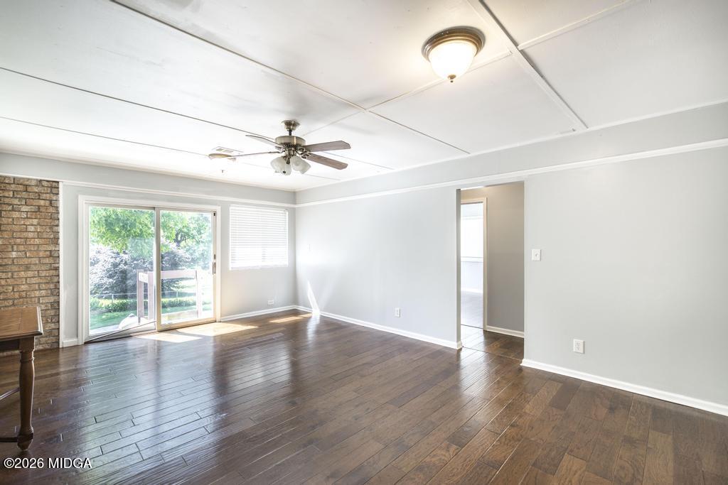 3710 Sandy Circle Macon, GA 31216 - Photo 27 of 44 an empty room with wooden floor fan and windows