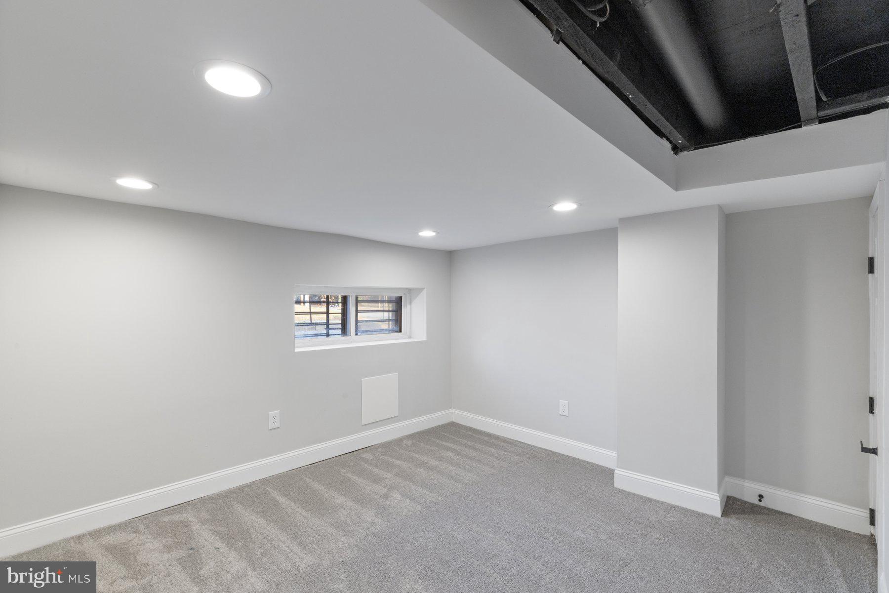653 Bartlett Avenue Baltimore, MD 21218 - Photo 27 of 39 Lower level den/recreation room