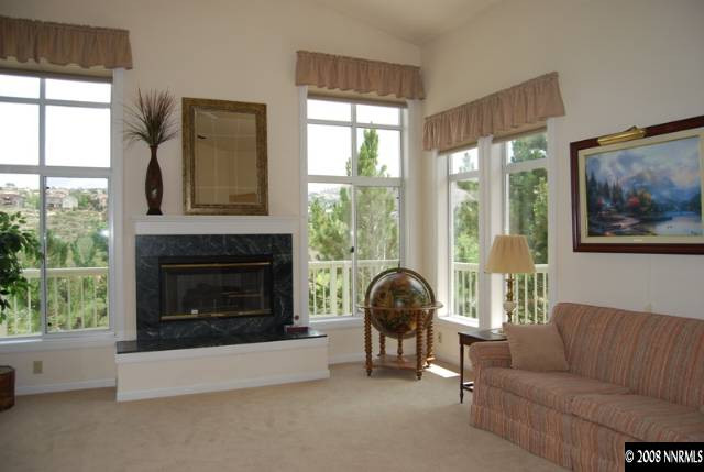 45 Rimfire Circle Reno, NV 89519 - Photo 3 of 9 a living room with furniture and a fireplace