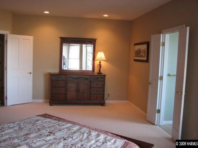 45 Rimfire Circle Reno, NV 89519 - Photo 6 of 9 a bedroom with a bed and a dresser