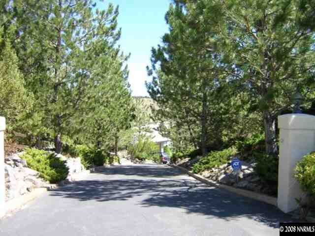 45 Rimfire Circle Reno, NV 89519 - Photo 7 of 9 a view of a street with potted plants and large trees