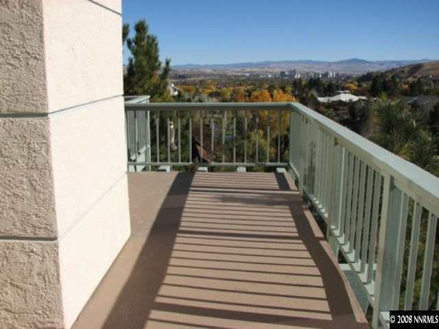 45 Rimfire Circle Reno, NV 89519 - Photo 8 of 9 a view of balcony with wooden floor and lake view