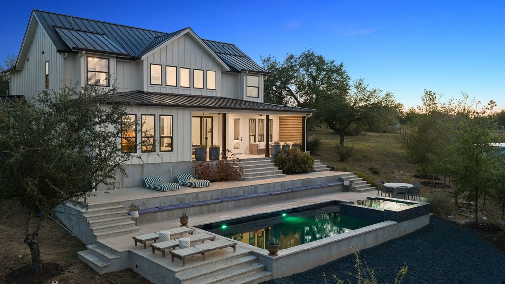 32045 Mirela Ann Road Dripping Springs, TX 78620 - Photo 2 of 30 Multi-level concrete terraces descend gracefully to a lighted rectangular pool and spa.
