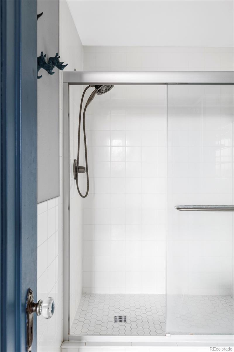 3309 Blake Street, Unit 207 Denver, CO 80205 - Photo 14 of 14 a bathroom with a shower