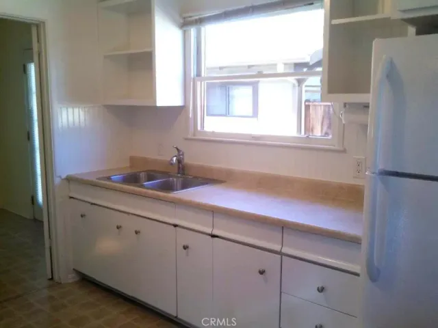 a kitchen with a sink and a window