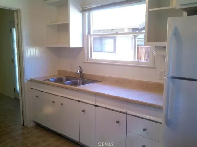 a kitchen with a sink and a window