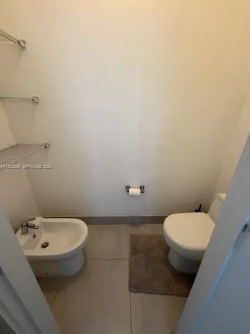 a bathroom with a toilet and a sink
