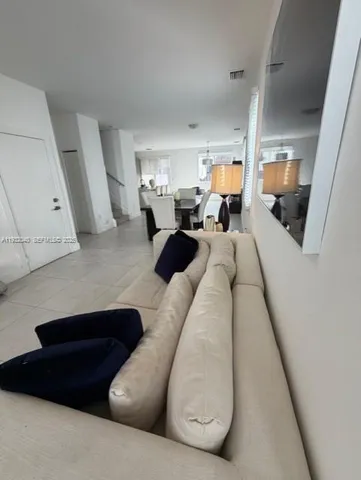 a living room with furniture and a couch