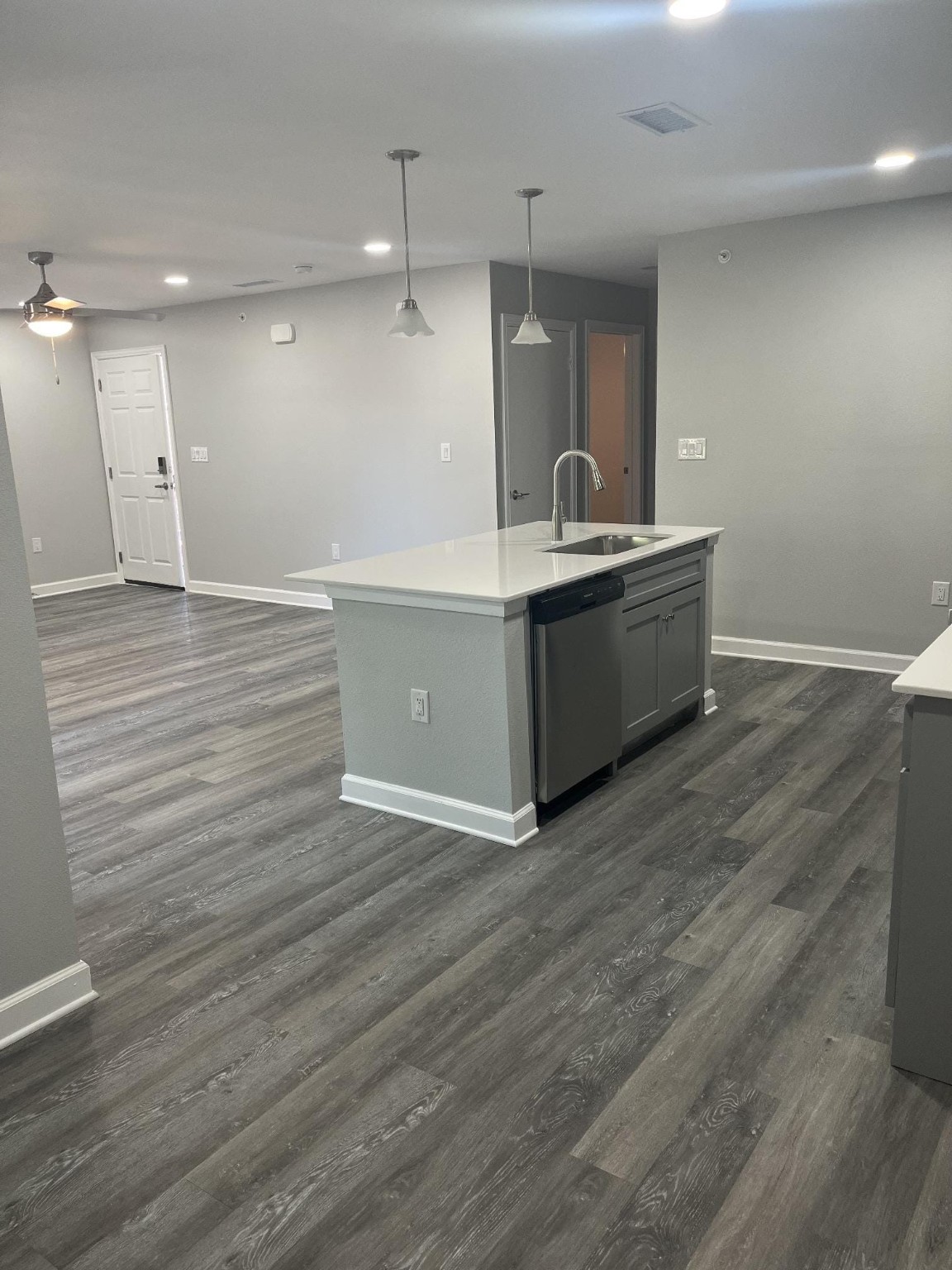 1500 South Jupiter Road, Unit 607 Allen, TX 75002 - Photo 5 of 7 a large kitchen with a wooden floor and a sink