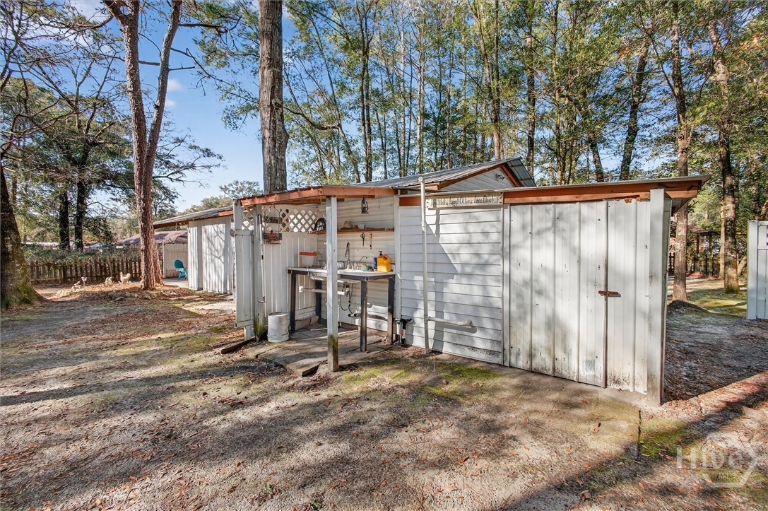 131 Deerwood Court Rincon, GA 31326 - Photo 42 of 54 Outdoor Sink and Additional Storage on the Right
