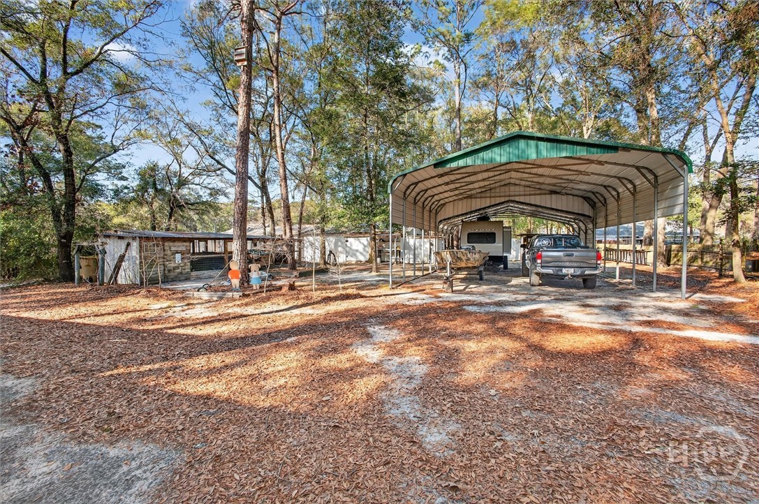 131 Deerwood Court Rincon, GA 31326 - Photo 46 of 54 Drive in Through the Gated Entry at the Back of the Property.