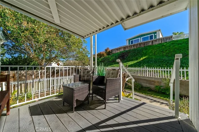 a view of a chair and table on the wooden floor