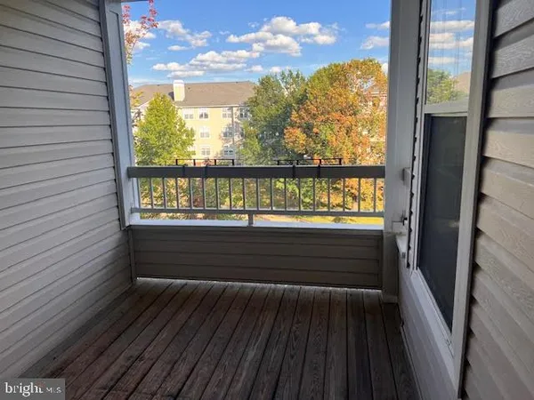a view of outdoor space with wooden floor