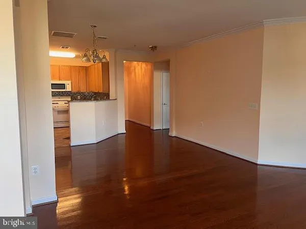 a view of a kitchen with a sink and a window
