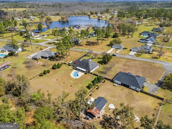 an aerial view of residential houses with outdoor space