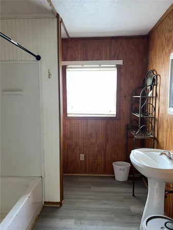 a bathroom with a sink mirror toilet and bathtub