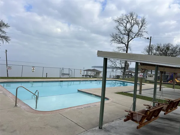 a view of swimming pool with a yard