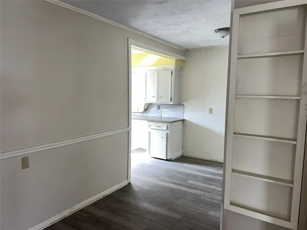 a kitchen with a refrigerator and a sink