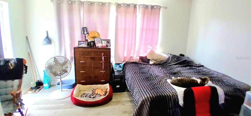 9643 Marlinton Lane Port Richey, FL 34668 - Photo 23 of 31 a bedroom with a bed and a window