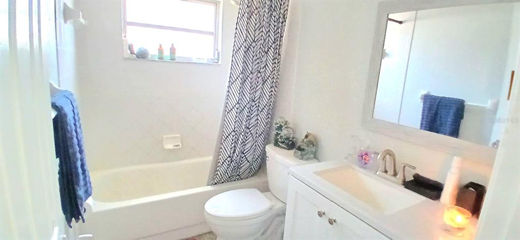 9643 Marlinton Lane Port Richey, FL 34668 - Photo 26 of 31 a bathroom with a sink toilet and shower