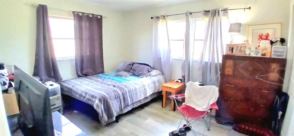 9643 Marlinton Lane Port Richey, FL 34668 - Photo 27 of 31 a bedroom with a bed and a window