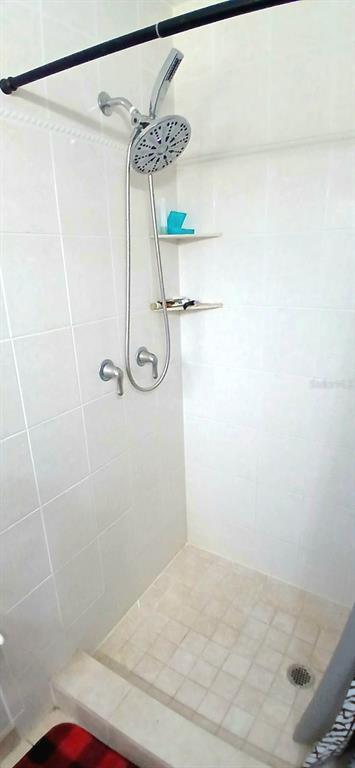 9643 Marlinton Lane Port Richey, FL 34668 - Photo 30 of 31 a bathroom with a shower