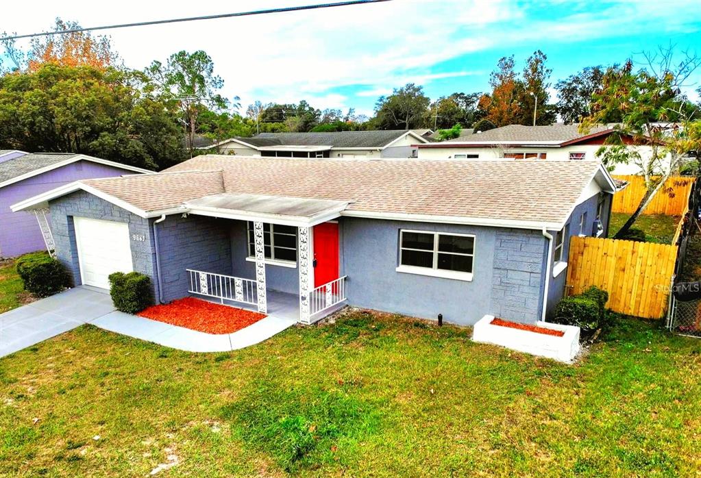 9643 Marlinton Lane Port Richey, FL 34668 - Photo 3 of 31 a house view with a garden space