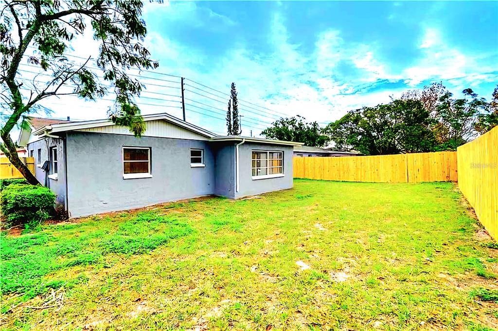 9643 Marlinton Lane Port Richey, FL 34668 - Photo 31 of 31 a view of a house with a backyard