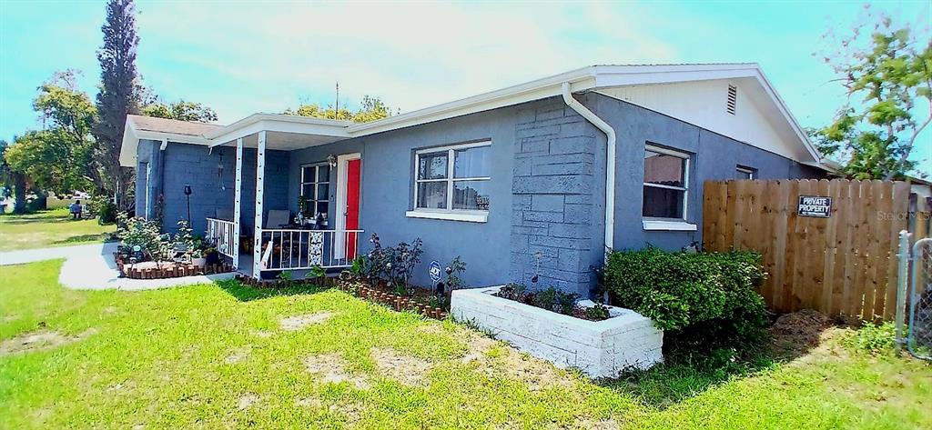 9643 Marlinton Lane Port Richey, FL 34668 - Photo 4 of 31 a view of a house with backyard and sitting area