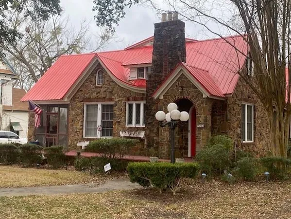 a front view of a house with garden