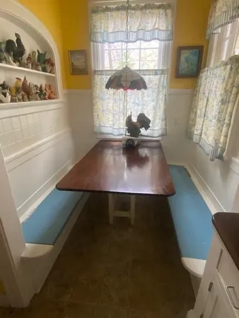a view of table and chair in room