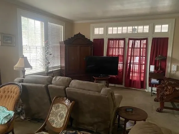 a living room with furniture fireplace and a flat screen tv
