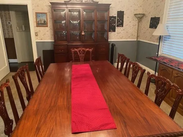 a balcony with table and chairs