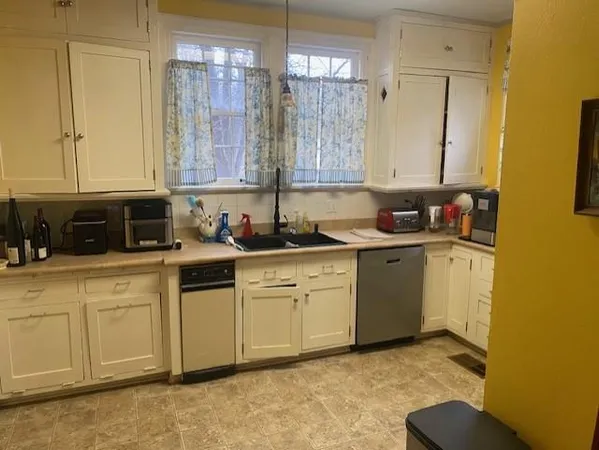 a view of a kitchen with electric appliances