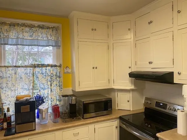 a kitchen with stainless steel appliances a stove and a refrigerator