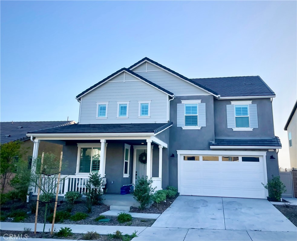 39547 Verbena Way Temecula, CA 92591 - Photo 1 of 31 a front view of a house with a garden and porch
